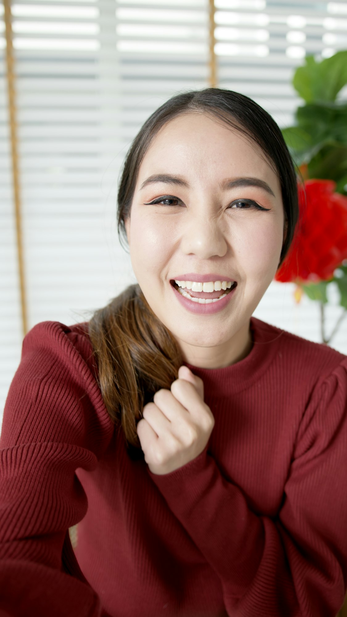 Attractive beautiful young asian lady in red chinese new year celebration